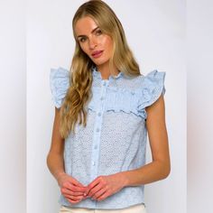 This Agnes Sleeveless Shirt Will Take You From Drab To Fab In An Eyelet! It Features A Button Down Front And Frilled Sleeves, Perfect For A Touch Of Street Style Drama. Be Sure To Let These Ruffles Do The Talking! Blue Sleeveless Buttoned Blouse, Sleeveless Blue Blouse With Buttons, Feminine Sleeveless Blue Blouse, Frilled Sleeves, Central Park West, Ivory Silk, Mixing Fabrics, Sleeveless Shirt, Central Park