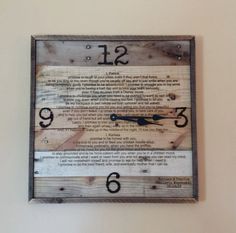 a clock that is mounted to the wall with numbers and words on it's sides