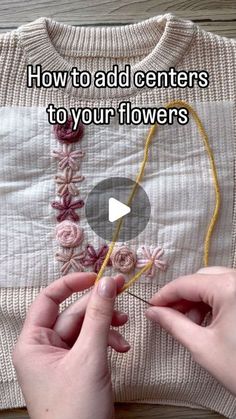 someone is knitting flowers on a sweater with the words how to add centers to your flowers