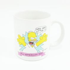 a white coffee mug with the simpsons saying when you little, all american dad