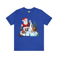 a blue t - shirt with santa clause on it and reindeers in the snow