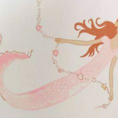 a drawing of a mermaid with pink hair and pearls on it's tail, flying through the air