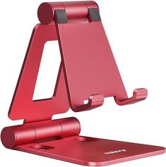 a red cell phone holder on top of a metal device stand with one side open