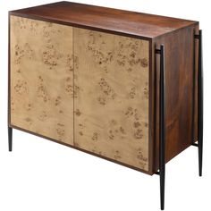 the sideboard is made from wood and has black metal legs, with an animal print design on it