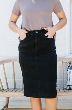 Our new and improved take on the classic 'Leah' Denim Skirt in Black! Modesty. Comfort. Style. This denim midi skirt has it all... stretch, cotton fabric and a timeless button-fly closure! We love that the simple lines of the 'Leah' skirt add a touch of class to any outfit. Designed by us with you in mind, we think you are going to fall in love with this skirt as much as we did! 97% Cotton 3% Spandex Machine Wash Cold Tumble Dry Low or Hang to Dry Do Not Bleach Low Iron if Needed Do Not Dry Clea Knee Length Denim Skirt Outfit, Apostolic Fashion Casual, Modest Skirt Outfits, Denim Pencil Skirt Outfit, Denim Skirt Knee Length, Black Denim Midi Skirt, Skirts Modest, Modest Skirt