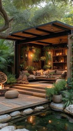 an outdoor living area with rocks and plants