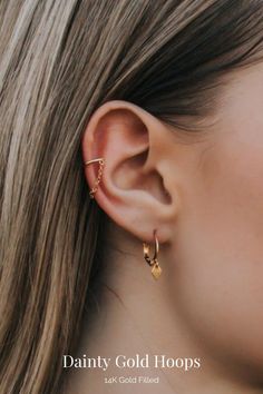 These gold huggie earrings with diamond shaped charms are dainty and perfect for everyday wear. They're one click, easy to put on, and great for sensitive ears. THE DETAILS: 🖤 12mm Hoops in 14k Gold Filled, Gold Stainless Steel, Sterling Silver or Silver Plated Brass 🖤 6.5mm Diamond Shaped Charms in 14k Gold Filled or Silver Plated Brass 🖤 Lead and Nickel Free 🖤 Comes in a Pair Trendy Dangle Huggie Earrings, Trendy Gold Ear Wire Piercings, Trendy Gold Dangle Cartilage Earrings, Trendy Gold Hoop Earrings With Dangling Charms, Minimalist Hoop Earrings With Dangling Charms, Gold Huggie Earrings, Silver Wrapping Paper, Mini Hoop Earrings, Gold Jewelry Simple