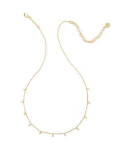 We’re obsessed with the dainty detailing on the Henry Strand Necklace in Gold. From its diamond-shaped metal charms to its delicate chain, this necklace will bring eye-catching texture to every layered look. Metal 14k Gold Over Brass Closure Lobster Clasp Size 16" Chain With 3" ExtenderDue to the one-of-a-kind nature of the medium, exact colors and patterns may vary slightly from the image shown. | Kendra Scott Henry Strand Necklace in Gold | Metal Kendra Scott Layering Necklaces, Layering Kendra Scott Necklaces, Kendra Scott Store, Plain Necklace, Bday Wishlist, Cute Necklaces, Sold Out Sign, Kendra Scott Necklace, Metal Charms