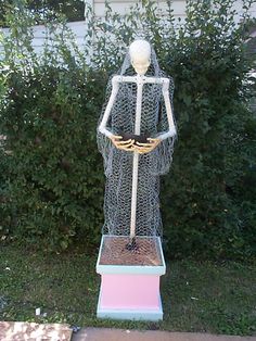 there is a statue made out of wire in the yard