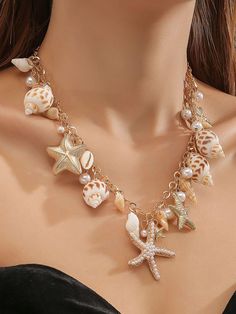 Description: sea with this beautifully crafted statement necklace, featuring a stunning array of seashells, starfish, and pearl accents. This gold-tone chain is adorned with intricately detailed seashells and starfish charms, adding a luxurious touch to the coastal-themed design. Perfect for beach lovers and ocean-inspired outfits, this necklace offers an elegant yet playful aesthetic for any occasion. Features: Gold-tone chain with seashell and starfish charms Faux pearls for added elegance Lightweight and comfortable to wear Ideal for beachwear, summer outfits, or as a thoughtful gift Handmade Necklace Shipping time: Worldwide: 10-25 business days United States: 5-15 business days Europe: 7-15 business days Australia, New Zealand and Oceania: 15-30 business days Seashell Necklace Aesthetic, Starfish Necklace Gold, Jewellery Simple, Playful Aesthetic, Simple Jewellery, Gold Beach, Pendant Minimalist, Minimalist Jewellery, Beach Necklace