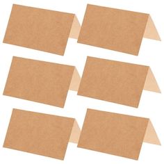 six pieces of brown paper are arranged in the shape of rectangles