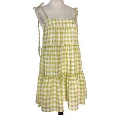 Get Ready To Turn Heads With This Stunning Altar'd State Gingham Tiered Mini Sundress, Perfect For Any Occasion! Featuring A Square Neckline With Strappy Sleeves And A Tie Closure, This Colorful Dress Is Made Of High-Quality Polyester Fabric And Is Fully Lined. The Layered Accents And Short Dress Length Add A Touch Of Boho Vibes, Making It A Great Choice For Summer, Fall, And Spring. This Dress Is Sized As Small And Is Crafted For Women Who Love To Express Their Unique Style. Don't Miss Out On T Casual Tiered Gingham Dresses, Casual Gingham Tiered Dress, Summer Plaid Dress With Tie Straps, Plaid Summer Dress With Tie Straps, Spring Beach Plaid Dress, Plaid Cotton Sundress For Vacation, Beach Dress With Gingham Print And Tie Straps, Gingham Dress With Tie Straps For Beach, Spring Gingham Dress With Tie Straps