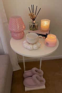 a white table with candles and other items on it