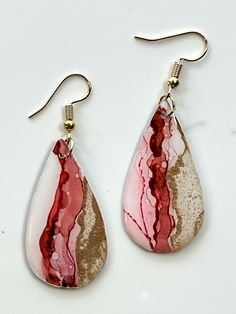 two pairs of pink and gold tear shaped earrings