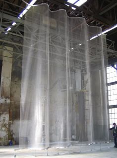 an industrial building with plastic covering the walls