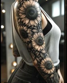 a woman's arm with sunflowers on it