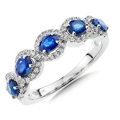 a white gold ring with blue sapphires and diamonds