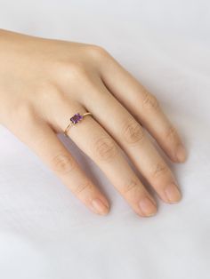 A unique spin on a modern classic. The Lady's Mantle Amethyst ring stuns with an amethyst center stone of a rich purple. It's a great present for those born in the month of love, February. Purple Birthstone Ring In 14k Gold, Purple Ruby Ring In 14k Gold, 14k Gold Amethyst Ring With Lavender Gemstone, 14k Gold Lavender Amethyst Ring, Purple Birthstone Ring In 14k Gold For Promise, Rose Gold Amethyst Birthstone Ring, Minimalist Purple Birthstone Promise Ring, Purple Birthstone Ring With Center Stone In 14k Gold, Purple Amethyst Birthstone Ring In 14k Gold