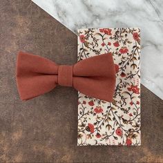 This Stylish Combination Is Perfect For The Groom And Groomsmen To Coordinate In Your Desert Or Boho-Themed Wedding Party! Includes: (1) Velour Micro-Twill Bow Tie | Cotton/Polyester Blend | One Size | Pre-Tied W/ Adjustable Strap | Maximum Neck Size 18”- 19” | Bow Measures Approx. (W) 4.7”X (L) 2.4”| Dry Clean Only (1) Floral Print Pocket Square | 100% Cotton | Approx. 12 X 12 In. | Dry Clean Only Thank You! Rust Tie, Burgundy Bow Tie, Floral Pocket Square, Baked Clay, Groom Ties, Baking Clay, Floral Pocket, Groom Attire, Groom And Groomsmen