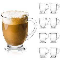 a glass mug filled with liquid next to six glasses on a white background, all in different shapes and sizes