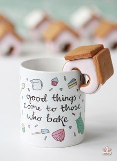 a coffee cup with a cookie in it and the words good things come to those who bake