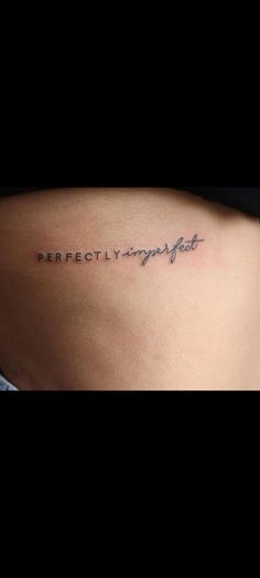 a woman's back with the words perfectly imperfect written on her left side ribcage