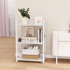 a white book shelf with books and baskets on it next to a dresser in a room