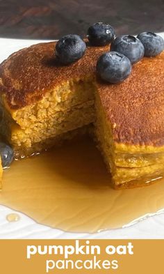 pumpkin oat pancakes with blueberries and syrup