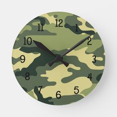 a clock with numbers and camouflage print on it