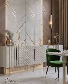 an elegant dining room with gold accents and green chairs