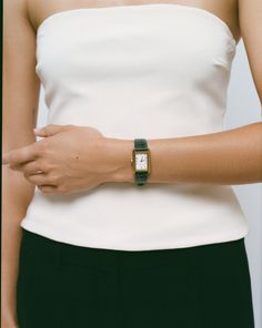 Meet The Diana Strap, one of the four interchangeable straps available in our Icon Watch Collection. The Green Diana Strap is made with green alligator style leather. The unique green strap is beyond chic and versatile. It evokes a touch of sophistication to any outfit you put on! Also available in the following color ways: Kelly - Black Red - Monroe Brown - Bruni Made with genuine leather. Please note - to wear the finished piece, you will also need to purchase The Icon Watch. Straps are sold s Elegant Watches For Everyday Use With Rectangular Shape, Elegant Adjustable Jewelry For Workwear, Elegant Adjustable Jewelry For Work, Elegant Leather Workwear Watch, Elegant Leather Watch For Work, Chic Everyday Watches, Classic Green Watch For Everyday Use, Chic Formal Watch With Leather Strap, Chic Formal Watches With Leather Strap