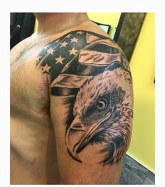 a bald eagle with an american flag tattoo on his arm