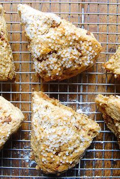 several pastries are cooling on a wire rack