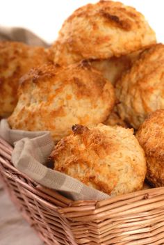 a basket full of biscuits sitting on top of a table