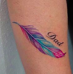 a colorful feather with the word dad written on it's side tattoo design for women