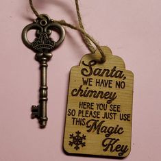 there is a key that has been placed next to a tag with the words santa, we have no chimney here you see so please just use this magic key