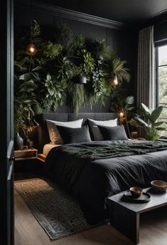 a bedroom with black walls and plants on the headboard, along with a large bed