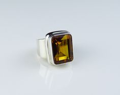 Sterling silver,rectangular shape ring with a citrine gemstone. Code  R_1253 Stone Measurement 17x12mm Weight approx  8.8g Rectangular Blue Topaz Ring, Yellow Citrine Topaz Ring Rectangular Shape, Luxury Silver Men's Ring With Citrine, Silver Citrine Gemstones For Fine Jewelry, Citrine Silver Ring, Classic Silver Citrine Rings, Silver Citrine Multi-stone Rings, Citrine Gemstone, Gemstone Ring