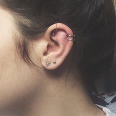 a woman with ear piercings on her ears