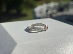 One-of-a-kind pure fine silver ruby ring hand-crafted from precious metal clay with leaf and vine detailing and three tiny peridot cubic zirconia - Size 7. Rubin Ring, Silver Ruby Ring, Vine Ring, Precious Metal Clay, Ring Hand, Metal Clay, Precious Metal, Ruby Ring, Stackable Rings