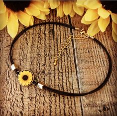 This is adorable sunflower choker 13 inches with a 2 inch extension, made out of Brown leather with gold metal beads, and a beautiful sunflower,If you need a larger size just let me know Adjustable Yellow Sunflower Design Jewelry, Adjustable Yellow Choker Jewelry, Sunflower Accessories, Sunflower Jewelry, Sunflower Necklace, Flower Choker, Sunflower Earrings, Boho Choker, Necklace Flower