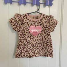 Baby Girl’s Juicy Couture Top. Top Is Tan & Pink Leopard Print Patterned With Ruffle Decorated Sleeves. Size 6-9 Months. Meant To Be A 3 Piece Set, But Is Only The Shirt. Brand New With Tags. Smoke Free Home! Juicy Couture Top, Juicy Couture Baby, Couture Top, Ruffle Sleeve Top, Pink Leopard Print, Couture Tops, Ruffled Sleeve Top, Top Top, Pink Leopard