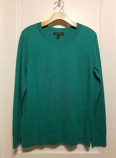 Banana Republic Merino Scallop Crew Pullover, Green, Size L, NWT Color: Emerald Green. Pictures with blue sweater used here just for example. See separate listing. Semi-fitted. Hits at the hip. Classic pullover sweater with a feminine touch. Scallop crew neck. Long sleeves. #582000 100% Extra-Fine Merino Wool. Hand wash cold. Imported.Approximate measurements, item laid flat: chest 19", length 26.5". Final sale. No returns please. From a clean, smoke and pet free environment.  Thank you! Fitted Green Fine Knit Sweater, Green Stretch Long Sleeve Top With Crew Neck, Green Stretch Sweater In Fine Knit, Green Fine Knit Stretch Sweater, Green Stretch Fine Knit Sweater, Green Crew Neck Sweater For Workwear, Stretch Fine Knit Crew Neck Sweater, Green Stretch Crew Neck Sweater, Green Crew Neck Knit Top