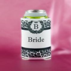 a can of beer with the word bride on it sitting on a pink tablecloth