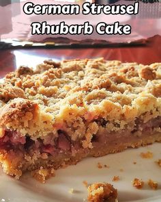 a close up of a piece of food on a plate with the words german streusel rhubarb cake