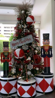 a christmas tree decorated with nutcrackers and decorations