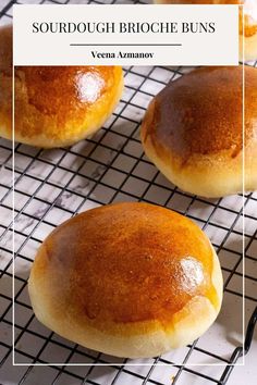 three round bread buns on a cooling rack with the words sourdough brioche buns