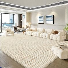 a living room filled with furniture and a large rug