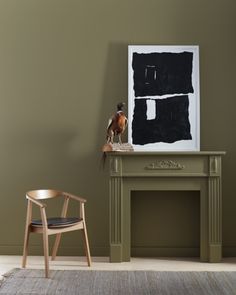 a living room with a chair, table and painting on the wall