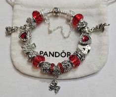 AUTHENTIC Pandora Barrel Clasp Bracelet  and come with a receipt. While I use high quality beads and charms on the Pandora bracelet,  the charms and beads used on the bracelet are NOT Pandora Brand, making the bracelet very affordable.  Beads and charms include: Red single core diamond faceted beads, crystal beads. Cupid charm, I Love You bead, Kissing Couple charm, 4ever bead, Bear Heart bead Includes  Security Chain, Clasp Bead, Gift box and ships USPS Priority Mail Pandora Bracelet Shown is  7.9 with barrel clasp Per Pandora  Make your jewelry the last thing you put on in the morning and first thing you take off at night. High & Dry Remove jewelry prior to swimming, bathing and other sporting/physical activities and limit contact with make-up, creams, perfume and lotions. Red Pandora Charms, Pandora Christmas Bracelet, Pandora Spiderman Bracelet, Red Pandora Bracelet, Pandora Charms Red, Be Mine Forever, Charm Bracelet Pandora, Pandora Bracelet Charms Ideas